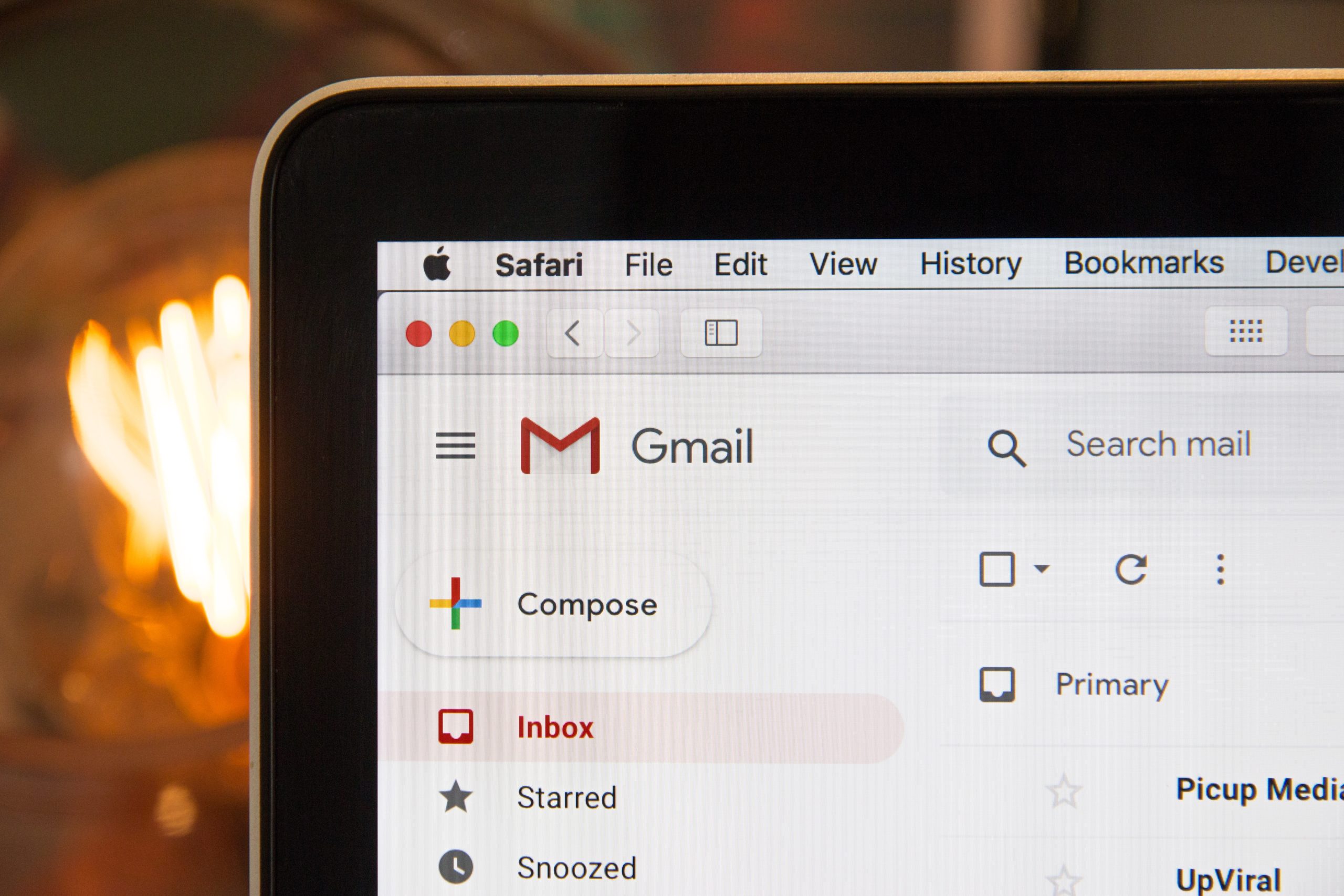 A black laptop showing an open Gmail account